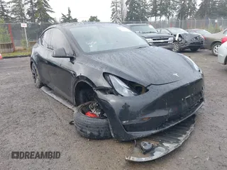 2021 Tesla Model Y Performance z VIN 5YJYGDEF2MF215938, wystawiony jako IAAI lot #41338287 z przebiegiem 63 925 mil mil oraz . Historia ofert i sprzedaży dostępna na DreamBid. Obrazek 6.