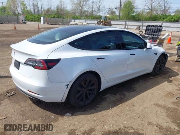 2020 Tesla Model 3 Standard Range Plus with VIN 5YJ3E1EA3LF785951, listed as a IAAI auction lot 41919339 with 63,025 mi miles and . Bid and sale history available at carsss.com. Image 4.
