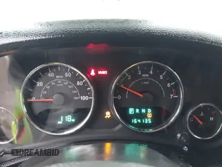 2012 Jeep Wrangler Sport z VIN 1C4AJWAG8CL262755, wystawiony jako IAAI lot #41566823 z przebiegiem 164 135 mil mil oraz . Historia ofert i sprzedaży dostępna na DreamBid. Obrazek 7.