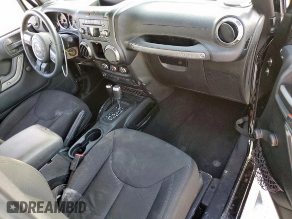 2015 Jeep Wrangler Freedom Edition with VIN 1C4AJWAG8FL541675, listed as a Copart auction lot 62647855 with 53,915 mi miles and Salvage title. Bid and sale history available at DreamBid. Image 8.