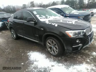 2015 BMW X4 xDrive28i with VIN 5UXXW3C57F0M87064, listed as a IAAI auction lot 38583109 with 171,930 mi miles. Bid and sale history available at carsss.com. Image 1.