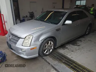 2011 Cadillac STS RWD with VIN 1G6DW6ED4B0120517, listed as a IAAI auction lot 41765069 with 120,059 mi miles and . Bid and sale history available at DreamBid. Image 2.