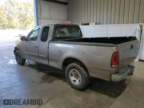 2003 Ford F-150 XL with VIN 1FTRX17283NA46215, listed as a Copart auction lot 85194094 with 168,415 mi miles and Salvage title. Bid and sale history available at DreamBid. Image 2.