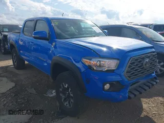 2021 Toyota Tacoma SR z VIN 3TYCZ5AN9MT036965, wystawiony jako IAAI lot #41142844 z przebiegiem 22 716 mil mil oraz . Historia ofert i sprzedaży dostępna na DreamBid. Obrazek 1.
