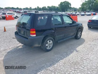 2007 Ford Escape XLS with VIN 1FMYU02ZX7KB90581, listed as a IAAI auction lot 42430544 with 164,595 mi miles and . Bid and sale history available at DreamBid. Image 4.