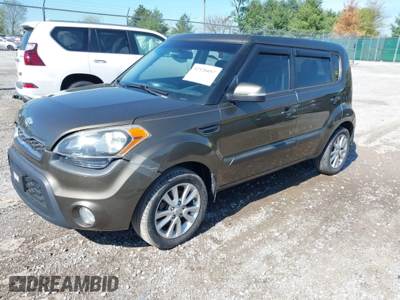 2012 Kia Soul + with VIN KNDJT2A60C7472303, listed as a IAAI auction lot 42126057 with 308,726 mi miles. Bid and sale history available at carsss.com. Image 2.
