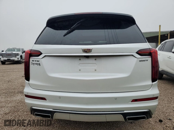 2021 Cadillac XT6 Luxury z VIN 1GYKPAR46MZ132157, wystawiony jako Copart lot #83911054 z przebiegiem 59 473 mil mil oraz Czysty tytuł • Clean title. Historia ofert i sprzedaży dostępna na DreamBid. Obrazek 6.