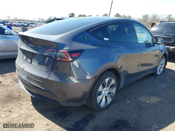 2023 Tesla Model Y Long Range with VIN 7SAYGDEEXPA175104, listed as a IAAI auction lot 41821928 with 52,791 mi miles. Bid and sale history available at carsss.com. Image 4.
