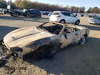 1999 Jaguar XK with VIN SAJGX2040XC031929, listed as a Copart auction lot 84032304 with Not Provided miles and Salvage Title. Bid and sale history available at DreamBid. Image 1.