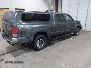 2016 Toyota Tacoma SR5 with VIN 3TMDZ5BNXGM009423, listed as a IAAI auction lot 41008068 with 107,426 mi miles and . Bid and sale history available at DreamBid. Image 4.