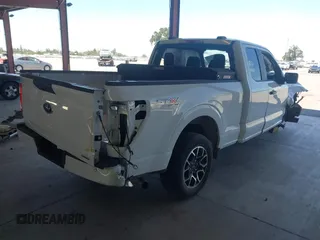 2023 Ford F-150 XL with VIN 1FTEX1CP1PKE18310, listed as a IAAI auction lot 42337133 with 26,931 mi miles and . Bid and sale history available at DreamBid. Image 4.