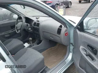 2003 Hyundai Accent GL with VIN KMHCG45C33U473080, listed as a IAAI auction lot 41868765 with 57,478 mi miles. Bid and sale history available at carsss.com. Image 5.