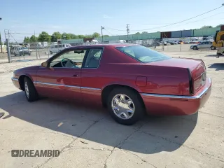 1997 Cadillac Eldorado ESC z VIN 1G6EL12Y5VU614955, wystawiony jako Copart lot #56222345 z przebiegiem 62 030 mil mil oraz Tytuł czysty. Historia ofert i sprzedaży dostępna na DreamBid. Obrazek 2.