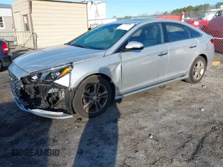 2018 Hyundai Sonata SEL z VIN 5NPE34AF0JH599137, wystawiony jako IAAI lot #41865261 z przebiegiem 63 719 mil mil oraz . Historia ofert i sprzedaży dostępna na DreamBid. Obrazek 2.