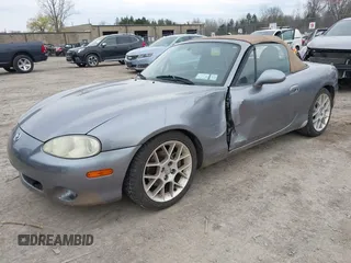 2002 Mazda MX-5 Miata Cloth z VIN JM1NB353X20227591, wystawiony jako IAAI lot #42066430 z przebiegiem 79 585 mil mil oraz . Historia ofert i sprzedaży dostępna na DreamBid. Obrazek 2.