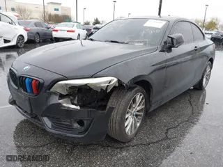 2014 BMW 2 Series 228i with VIN WBA1F5C57EV256067, listed as a IAAI auction lot 41283608 with 108,128 mi miles. Bid and sale history available at carsss.com. Image 2.