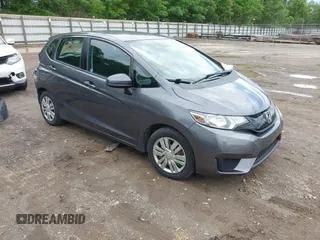 2015 Honda Fit LX z VIN 3HGGK5H59FM714352, wystawiony jako IAAI lot #42156097 z przebiegiem 103 587 mil mil oraz . Historia ofert i sprzedaży dostępna na DreamBid. Obrazek 1.