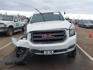 2019 GMC Yukon SLT with VIN 1GKS2BKC1KR167766, listed as a IAAI auction lot 41902532 with 97,793 mi miles. Bid and sale history available at carsss.com. Image 12.