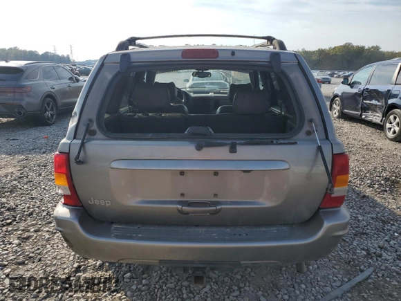 1999 Jeep Grand Cherokee Limited with VIN 1J4G268S7XC668348, listed as a Copart auction lot 77824084 with 165,779 mi miles and Salvage title. Bid and sale history available at DreamBid. Image 6.