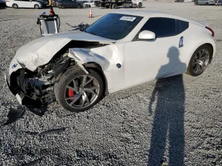 2014 Nissan 370Z Touring with VIN JN1AZ4EH7EM637101, listed as a Copart auction lot 41339705 with 105,841 mi miles and Salvage Title. Bid and sale history available at carsss.com. Image 1.