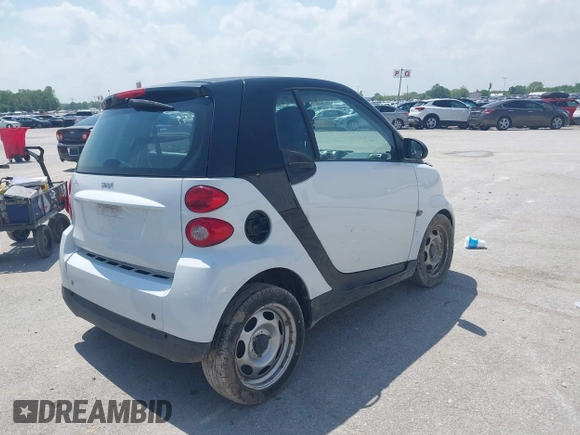 2009 Smart fortwo Pure with VIN WMEEJ31XX9K302737, listed as a IAAI auction lot 42124550 with 43,610 mi miles and . Bid and sale history available at DreamBid. Image 4.