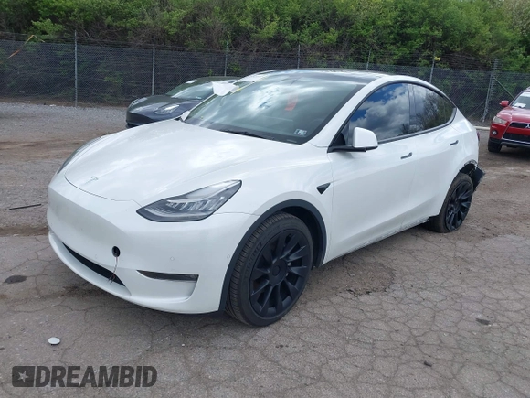 2022 Tesla Model Y Long Range z VIN 7SAYGDEE7NF385207, wystawiony jako IAAI lot #42054449 z przebiegiem 52 834 mil mil oraz . Historia ofert i sprzedaży dostępna na DreamBid. Obrazek 19.