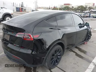 2022 Tesla Model Y Long Range z VIN 7SAYGDEE0NF508958, wystawiony jako IAAI lot #42191819 z przebiegiem 60 880 mil mil oraz . Historia ofert i sprzedaży dostępna na DreamBid. Obrazek 4.