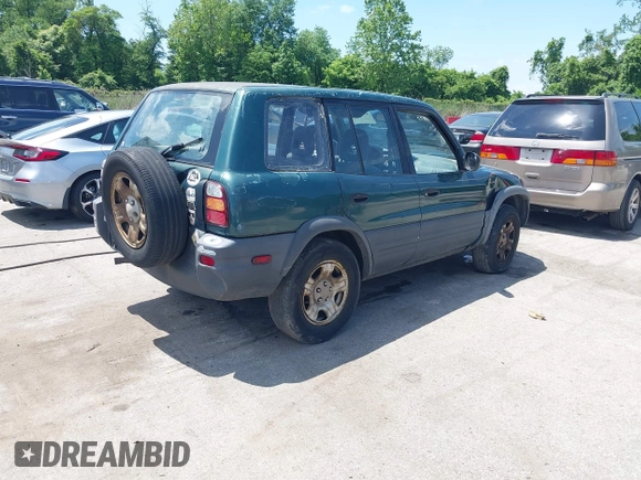 1998 Toyota RAV4 with VIN JT3GP10V6W0023680, listed as a IAAI auction lot 42235877 with 244,446 mi miles and . Bid and sale history available at DreamBid. Image 4.