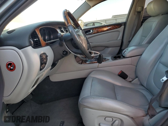 2004 Jaguar XJ with VIN SAJWA71C74SG20299, listed as a Copart auction lot 79469504 with 78,134 mi miles and Salvage Title. Bid and sale history available at carsss.com. Image 7.