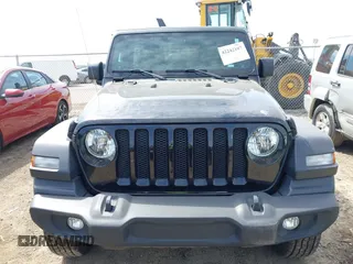 2023 Jeep Wrangler Sport S with VIN 1C4HJXDN6PW599895, listed as a IAAI auction lot 42242107 with 53,980 mi miles and . Bid and sale history available at DreamBid. Image 6.