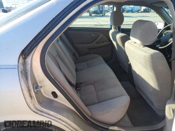 2000 Toyota Camry CE z VIN 4T1BG22K7YU738912, wystawiony jako Copart lot #88852845 z przebiegiem 122 569 mil mil oraz Szkoda całkowita • Salvage title. Historia ofert i sprzedaży dostępna na DreamBid. Obrazek 10.