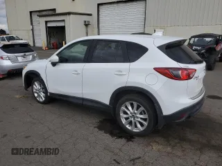 2014 Mazda CX-5 Grand Touring with VIN JM3KE4DY2E0354795, listed as a Copart auction lot 70713544 with 58,848 mi miles and Salvage Title. Bid and sale history available at DreamBid. Image 2.