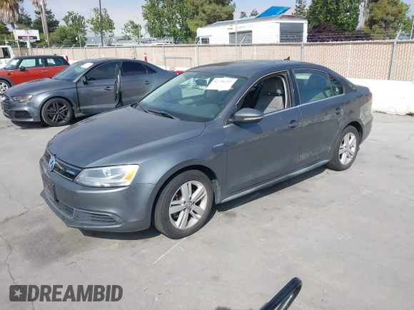 2013 Volkswagen Jetta Hybrid SE with VIN 3VW637AJ3DM305798, listed as a IAAI auction lot 42736297 with 156,972 mi miles and . Bid and sale history available at DreamBid. Image 2.