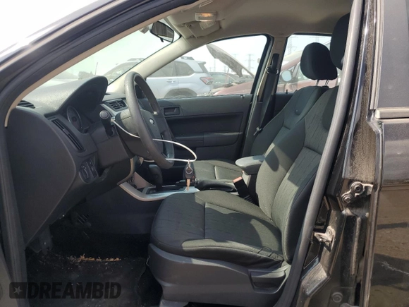 2008 Ford Focus SE z VIN 1FAHP35NX8W215744, wystawiony jako Copart lot #56096055 z przebiegiem 165 827 mil mil oraz Szkoda całkowita • Salvage title. Historia ofert i sprzedaży dostępna na DreamBid. Obrazek 7.