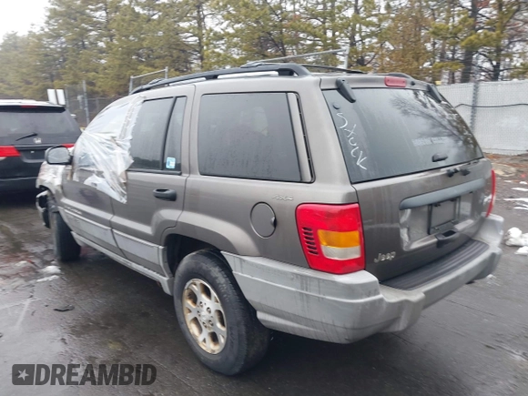2000 Jeep Grand Cherokee Laredo with VIN 1J4GW48S1YC170303, listed as a IAAI auction lot 41582257 with 191,062 mi miles and . Bid and sale history available at DreamBid. Image 3.