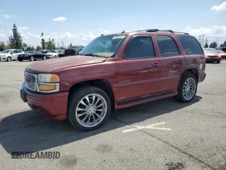 2003 GMC Yukon Denali z VIN 1GKEK63U23J262719, wystawiony jako Copart lot #51689125 z przebiegiem 192 941 mil mil oraz Szkody całkowita. Historia ofert i sprzedaży dostępna na DreamBid. Obrazek 1.