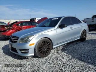 2014 Mercedes-Benz C 250 Sport with VIN WDDGF4HB8EA955064, listed as a Copart auction lot 63184135 with 104,735 mi miles and Salvage title. Bid and sale history available at DreamBid. Image 1.