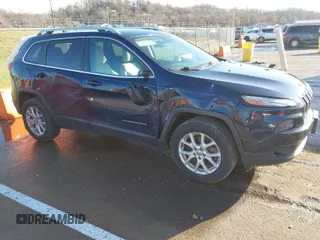 2015 Jeep Cherokee Latitude with VIN 1C4PJMCS0FW583658, listed as a IAAI auction lot 41106819 with 101,849 mi miles. Bid and sale history available at carsss.com. Image 1.