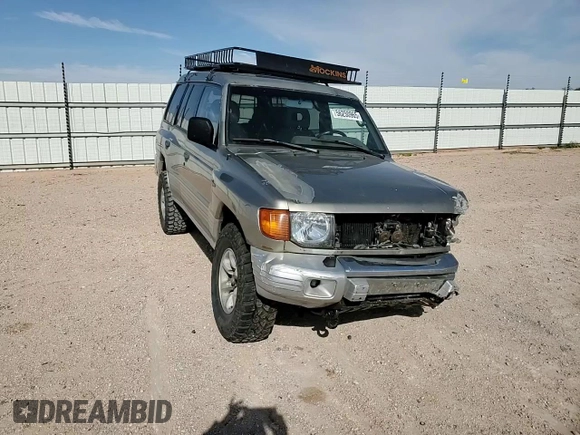 1998 Mitsubishi Montero z VIN JA4MR51R0WJ000921, wystawiony jako Copart lot #56250965 z przebiegiem 181 293 mil mil oraz Szkoda całkowita • Salvage title. Historia ofert i sprzedaży dostępna na DreamBid. Obrazek 15.