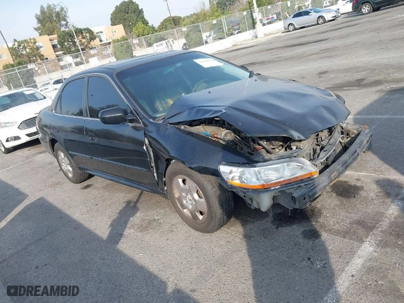 2002 Honda Accord Sdn EX w/Leather with VIN 1HGCG165X2A077913, listed as a IAAI auction lot 41470354 with 252,323 mi miles. Bid and sale history available at carsss.com. Image 1.