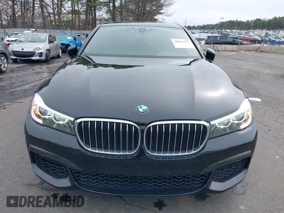 2019 BMW 7 Series 740i with VIN WBA7E2C57KB217973, listed as a IAAI auction lot 39064321 with 54,818 mi miles and . Bid and sale history available at DreamBid. Image 12.
