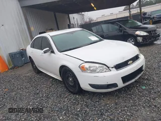 2013 Chevrolet Impala Police with VIN 2G1WD5E33D1210058, listed as a IAAI auction lot 41574143 with 156,643 mi miles. Bid and sale history available at carsss.com. Image 1.
