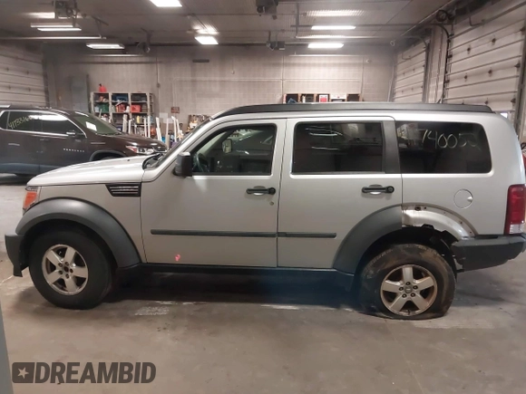 2007 Dodge Nitro SXT with VIN 1D8GU28K47W569317, listed as a IAAI auction lot 41740052 with 220,265 mi miles. Bid and sale history available at carsss.com. Image 14.