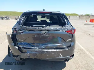 2017 Mazda CX-5 Grand Touring with VIN JM3KFADL6H0217850, listed as a IAAI auction lot 42033404 with 74,198 mi miles and . Bid and sale history available at carsss.com. Image 17.