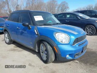 2014 MINI Countryman S with VIN WMWZC5C54EWM17299, listed as a IAAI auction lot 41655370 with 104,264 mi miles and . Bid and sale history available at DreamBid. Image 1.