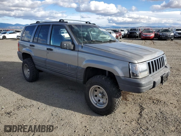 1998 Jeep Grand Cherokee Laredo with VIN 1J4GZ58S7WC316522, listed as a Copart auction lot 80201994 with 217,465 mi miles and Clean Title. Bid and sale history available at carsss.com. Image 4.