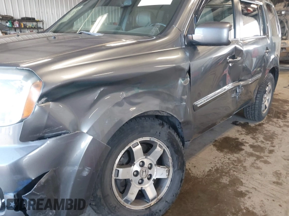 2010 Honda Pilot Touring with VIN 5FNYF4H89AB026005, listed as a IAAI auction lot 42118607 with 182,689 mi miles. Bid and sale history available at carsss.com. Image 6.