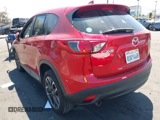 2016 Mazda CX-5 Grand Touring z VIN JM3KE2DY2G0660385, wystawiony jako IAAI lot #42101004 z przebiegiem 166 336 mil mil oraz . Historia ofert i sprzedaży dostępna na DreamBid. Obrazek 3.