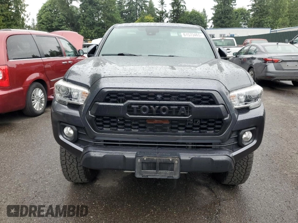 2020 Toyota Tacoma SR5 with VIN 3TMDZ5BN2LM097782, listed as a Copart auction lot 61573465 with 57,321 mi miles and Salvage title. Bid and sale history available at DreamBid. Image 5.