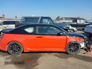 2015 Scion tC with VIN JTKJF5C71FJ006863, listed as a IAAI auction lot 41332681 with 91,559 mi miles. Bid and sale history available at carsss.com. Image 14.